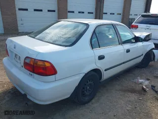 2000 Honda Civic LX with VIN JHMEJ6672YS009310, listed as a IAAI auction lot 41542202 with 143,337 mi miles. Bid and sale history available at carsss.com. Image 4.