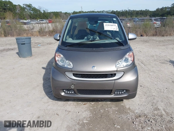 2012 Smart fortwo Pure z VIN WMEEJ3BA9CK557221, wystawiony jako IAAI lot #41828029 z przebiegiem 54 516 mil mil oraz . Historia ofert i sprzedaży dostępna na DreamBid. Obrazek 6.