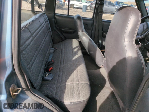 1999 Jeep Cherokee SE with VIN 1J4FF28S5XL646812, listed as a Copart auction lot 87951115 with 230,161 mi miles and Clean title. Bid and sale history available at DreamBid. Image 10.