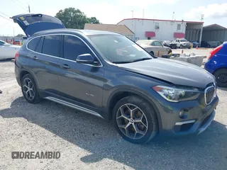 2018 BMW X1 xDrive28i with VIN WBXHT3C38J5F88807, listed as a IAAI auction lot 42463218 with 125,228 mi miles and . Bid and sale history available at DreamBid. Image 1.