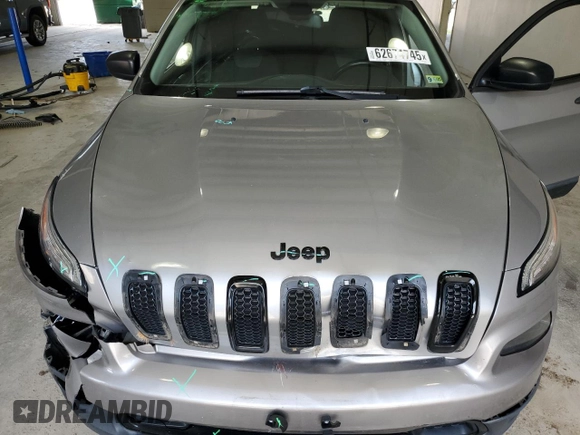 2017 Jeep Cherokee Altitude with VIN 1C4PJLABXHW586048, listed as a Copart auction lot 62674745 with 106,334 mi miles and Salvage title. Bid and sale history available at DreamBid. Image 12.