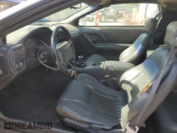 1997 Chevrolet Camaro Z28 z VIN 2G1FP22P1V2130346, wystawiony jako Copart lot #77366774 z przebiegiem 193 815 mil mil oraz Szkoda całkowita • Salvage title. Historia ofert i sprzedaży dostępna na DreamBid. Obrazek 7.