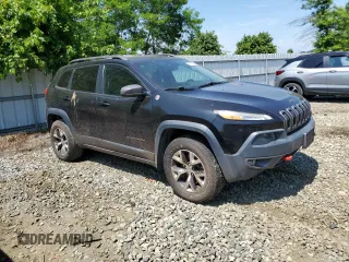 2015 Jeep Cherokee Trailhawk with VIN 1C4PJMBS6FW785891, listed as a Copart auction lot 61040565 with 156,421 mi miles and Clean title. Bid and sale history available at DreamBid. Image 4.