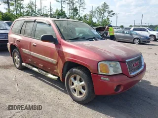 2004 GMC Envoy SLT with VIN 1GKDS13SX42334503, listed as a IAAI auction lot 42038781 with 242,680 mi miles. Bid and sale history available at carsss.com. Image 1.