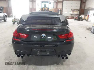 2014 BMW M6 z VIN WBSLZ9C58EDZ78401, wystawiony jako IAAI lot #41840114 z przebiegiem 23 499 mil mil oraz . Historia ofert i sprzedaży dostępna na DreamBid. Obrazek 16.