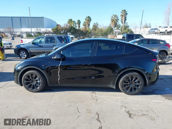 2024 Tesla Model Y Long Range with VIN 7SAYGDEEXRF983040, listed as a IAAI auction lot 41555332 with 79,506 mi miles and . Bid and sale history available at DreamBid. Image 14.