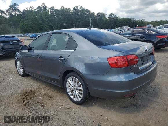 2014 Volkswagen Jetta TDI w/Premium with VIN 3VWLL7AJ4EM374570, listed as a Copart auction lot 63996195 with 186,497 mi miles and Salvage title. Bid and sale history available at DreamBid. Image 2.