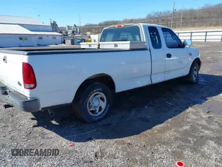 2002 Ford F-150 XL with VIN 1FTRX17L72NA76720, listed as a IAAI auction lot 41738935 with 92,506 mi miles. Bid and sale history available at carsss.com. Image 4.