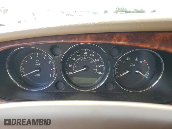 2004 Jaguar XJ with VIN SAJWA71C24SG28164, listed as a Copart auction lot 73968134 with 0 mi miles and Salvage Title. Bid and sale history available at carsss.com. Image 9.