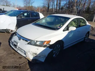 2006 Honda Civic Sdn LX with VIN 1HGFA16596L097028, listed as a IAAI auction lot 41561514 with 73,153 mi miles. Bid and sale history available at carsss.com. Image 2.