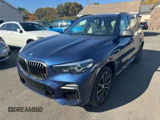 2021 BMW X5 M50i with VIN 5UXJU4C00M9H36466, listed as a Copart auction lot 77444344 with 100,119 mi miles and Clean Title. Bid and sale history available at carsss.com. Image 1.