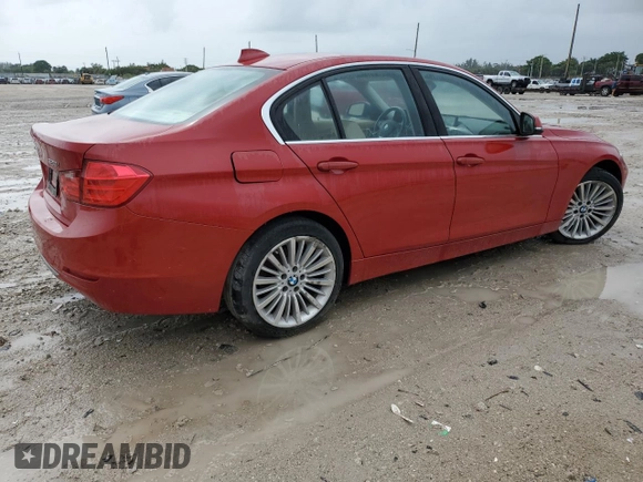 2014 BMW 3 Series 328i xDrive with VIN WBA3B3C59EJ977670, listed as a Copart auction lot 61997165 with 128,937 mi miles and Salvage title. Bid and sale history available at DreamBid. Image 3.