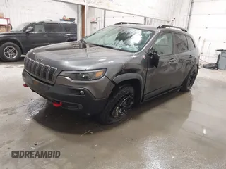 2022 Jeep Cherokee Trailhawk z VIN 1C4PJMBX9ND514703, wystawiony jako IAAI lot #41761037 z przebiegiem 38 499 mil mil oraz . Historia ofert i sprzedaży dostępna na DreamBid. Obrazek 17.