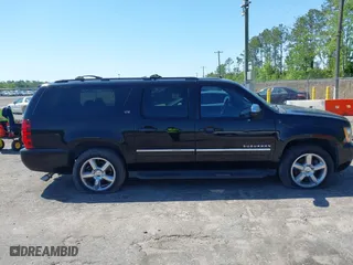 2011 Chevrolet Suburban LTZ with VIN 1GNSCKE01BR275919, listed as a IAAI auction lot 42038399 with 247,841 mi miles. Bid and sale history available at carsss.com. Image 13.