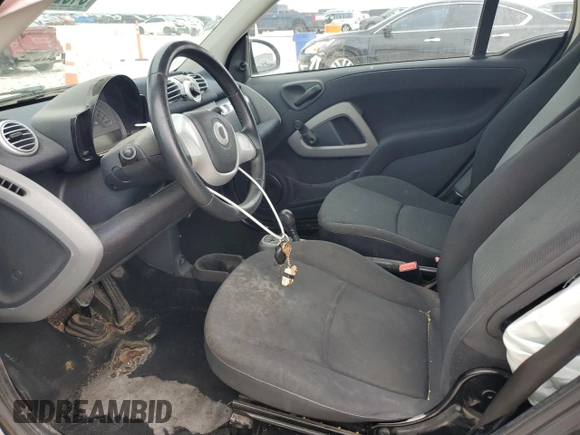 2013 Smart fortwo Pure with VIN WMEEJ3BA1DK633239, listed as a Copart auction lot 54829205 with 147,647 mi miles and Salvage Title. Bid and sale history available at carsss.com. Image 7.
