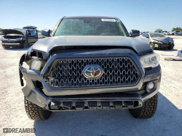 2018 Toyota Tacoma SR5 with VIN 3TMAZ5CNXJM057187, listed as a Copart auction lot 48705665 with 120,057 mi miles and Salvage Title. Bid and sale history available at carsss.com. Image 5.