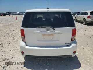 2013 Scion xB z VIN JTLZE4FE2DJ033668, wystawiony jako Copart lot #56171585 z przebiegiem 117 646 mil mil oraz Szkody całkowita. Historia ofert i sprzedaży dostępna na DreamBid. Obrazek 6.