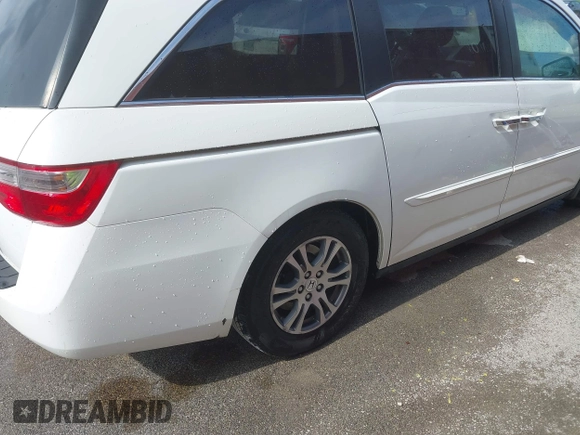 2011 Honda Odyssey EX-L with VIN 5FNRL5H60BB026171, listed as a IAAI auction lot 42511296 with 288,827 mi miles and . Bid and sale history available at DreamBid. Image 18.