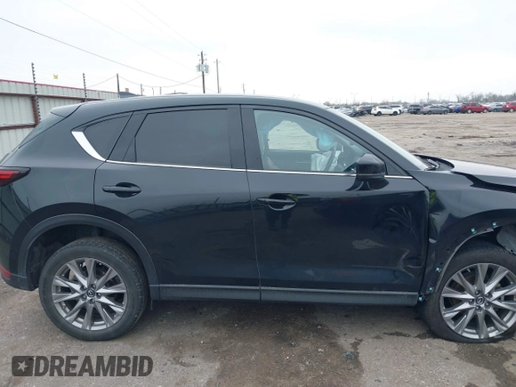 2020 Mazda CX-5 Grand Touring with VIN JM3KFADM8L0811910, listed as a IAAI auction lot 41446214 with 57,849 mi miles. Bid and sale history available at carsss.com. Image 14.