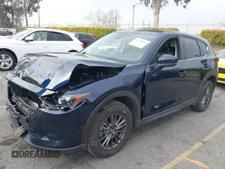 2019 Mazda CX-5 Touring with VIN JM3KFACM5K0697137, listed as a IAAI auction lot 41720253 with 50,416 mi miles. Bid and sale history available at carsss.com. Image 2.