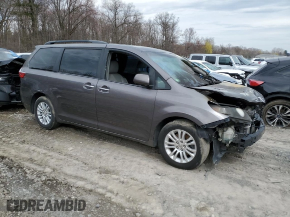 2015 Toyota Sienna XLE with VIN 5TDYK3DC4FS574285, listed as a Copart auction lot 49284185 with 0 mi miles and Salvage Title. Bid and sale history available at carsss.com. Image 4.
