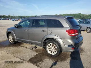 2013 Dodge Journey SXT with VIN 3C4PDCBG0DT522408, listed as a Copart auction lot 62699195 with 130,665 mi miles and Salvage title. Bid and sale history available at DreamBid. Image 2.