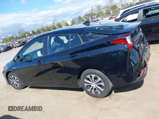 2021 Toyota Prius L Eco with VIN JTDKAMFU6M3135799, listed as a IAAI auction lot 42064241 with 77,120 mi miles and . Bid and sale history available at DreamBid. Image 14.