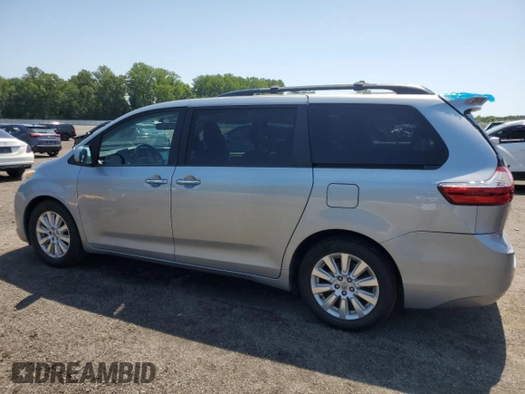 2015 Toyota Sienna Limited with VIN 5TDDK3DC4FS111836, listed as a Copart auction lot 61940595 with 111,579 mi miles and Salvage title. Bid and sale history available at DreamBid. Image 2.