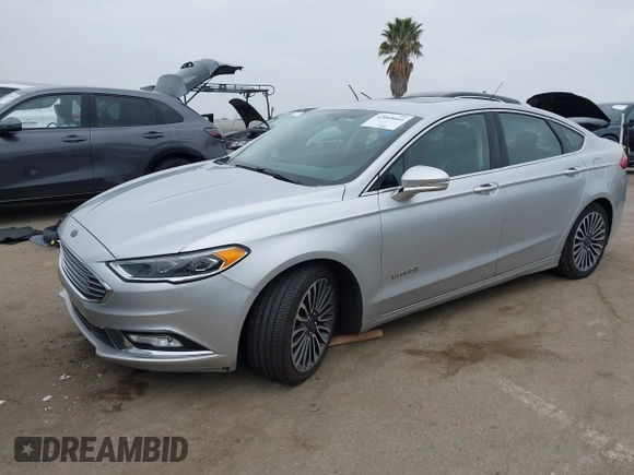 2017 Ford Fusion Hybrid Titanium z VIN 3FA6P0RU7HR300311, wystawiony jako IAAI lot #42045664 z przebiegiem 136 231 mil mil oraz . Historia ofert i sprzedaży dostępna na DreamBid. Obrazek 18.