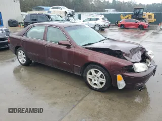 2001 Mazda 626 LX with VIN 1YVGF22D615249099, listed as a Copart auction lot 80753104 with 72,308 mi miles and Salvage Title. Bid and sale history available at carsss.com. Image 4.