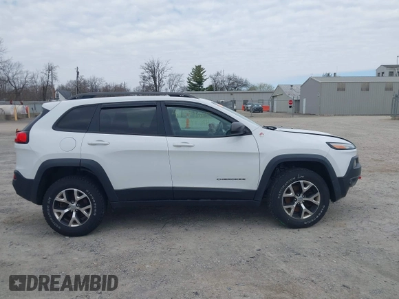 2015 Jeep Cherokee Trailhawk with VIN 1C4PJMBB7FW741365, listed as a IAAI auction lot 41879685 with 94,135 mi miles and . Bid and sale history available at carsss.com. Image 14.