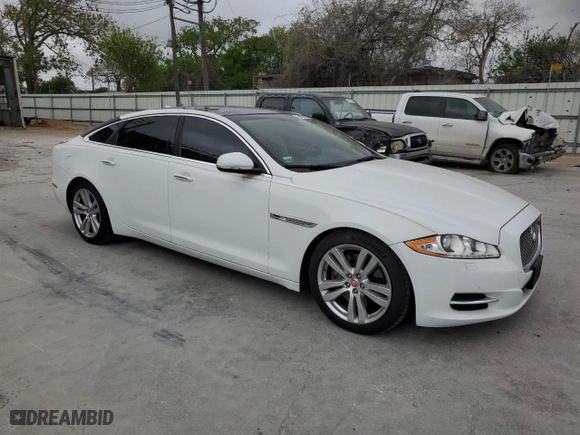 2014 Jaguar XJ with VIN SAJWJ2GD6E8V65987, listed as a Copart auction lot 50091105 with 136,080 mi miles and Clean Title. Bid and sale history available at carsss.com. Image 4.