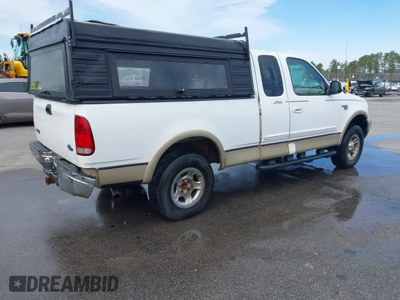 1999 Ford F-150 XL with VIN 1FTRX18LXXNA16159, listed as a IAAI auction lot 41746440 with 999,999 mi miles. Bid and sale history available at carsss.com. Image 4.