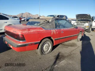 1989 Chrysler LeBaron z VIN 1C3XJ45K0KG251502, wystawiony jako Copart lot #87112404 z przebiegiem 166 445 mil mil oraz Tytuł czysty. Historia ofert i sprzedaży dostępna na DreamBid. Obrazek 3.