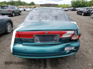 1996 Mercury Mystique z VIN 3MELM6530TM601366, wystawiony jako Copart lot #74239734 z przebiegiem 90 989 mil mil oraz Nie do naprawy. Historia ofert i sprzedaży dostępna na DreamBid. Obrazek 6.