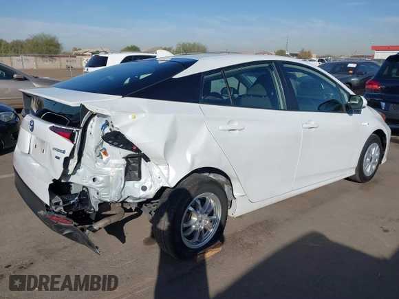 2021 Toyota Prius L Eco with VIN JTDKAMFU7M3133544, listed as a IAAI auction lot 41548653 with 115,214 mi miles and . Bid and sale history available at DreamBid. Image 4.