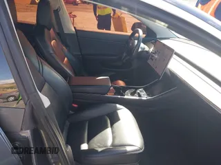 2019 Tesla Model 3 Mid Range with VIN 5YJ3E1EA6KF307456, listed as a IAAI auction lot 41944454 with 99,059 mi miles and . Bid and sale history available at DreamBid. Image 5.