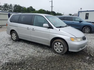 2004 Honda Odyssey EX-L with VIN 5FNRL18044B069774, listed as a Copart auction lot 57096535 with 165,307 mi miles and Salvage title. Bid and sale history available at DreamBid. Image 4.