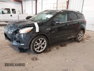 2016 Ford Escape Titanium with VIN 1FMCU0JX3GUB70607, listed as a IAAI auction lot 41727421 with 106,857 mi miles. Bid and sale history available at carsss.com. Image 2.