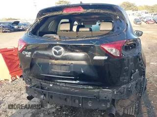 2015 Mazda CX-5 Grand Touring with VIN JM3KE4DY6F0513173, listed as a IAAI auction lot 41867030 with 93,770 mi miles. Bid and sale history available at carsss.com. Image 6.