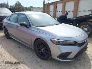 2022 Honda Civic Sport z VIN 2HGFE2F52NH527469, wystawiony jako IAAI lot #42173155 z przebiegiem 31 835 mil mil oraz . Historia ofert i sprzedaży dostępna na DreamBid. Obrazek 1.