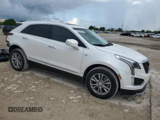 2022 Cadillac XT5 FWD Premium Luxury z VIN 1GYKNCRS0NZ175748, wystawiony jako Copart lot #61651885 z przebiegiem 13 747 mil mil oraz Szkoda całkowita • Salvage title. Historia ofert i sprzedaży dostępna na DreamBid. Obrazek 4.