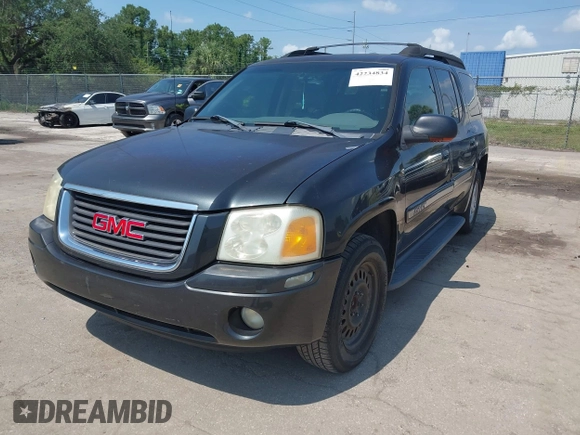 2003 GMC Envoy SLT with VIN 1GKES16S536169306, listed as a IAAI auction lot 42234834 with 239,144 mi miles and . Bid and sale history available at DreamBid. Image 2.
