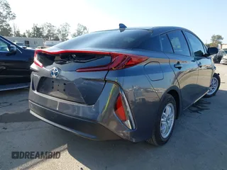 2021 Toyota Prius LE with VIN JTDKAMFP1M3195662, listed as a IAAI auction lot 42799476 with 47,560 mi miles and . Bid and sale history available at DreamBid. Image 4.