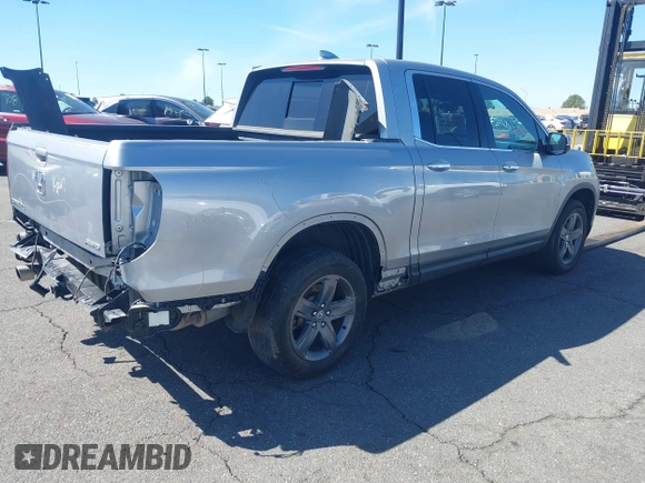 2022 Honda Ridgeline RTL-E with VIN 5FPYK3F78NB016045, listed as a IAAI auction lot 41626864 with 57,130 mi miles and . Bid and sale history available at DreamBid. Image 4.