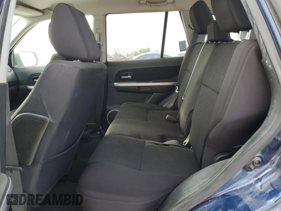 2012 Suzuki Grand Vitara Premium z VIN JS3TD0D29C4100139, wystawiony jako Copart lot #49163115 z przebiegiem 271 080 mil mil oraz Nie do naprawy. Historia ofert i sprzedaży dostępna na DreamBid. Obrazek 10.