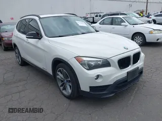 2015 BMW X1 sDrive28i with VIN WBAVM1C57FVW58575, listed as a IAAI auction lot 42116239 with 128,854 mi miles. Bid and sale history available at carsss.com. Image 1.