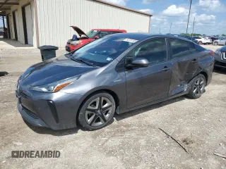 2019 Toyota Prius L Eco z VIN JTDKARFU3K3083235, wystawiony jako Copart lot #54374165 z przebiegiem 80 822 mil mil oraz Szkoda całkowita • Salvage title. Historia ofert i sprzedaży dostępna na DreamBid. Obrazek 1.