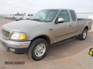 2001 Ford F-150 XL with VIN 2FTRX18L61CA36907, listed as a IAAI auction lot 41906933 with 317,857 mi miles. Bid and sale history available at carsss.com. Image 2.