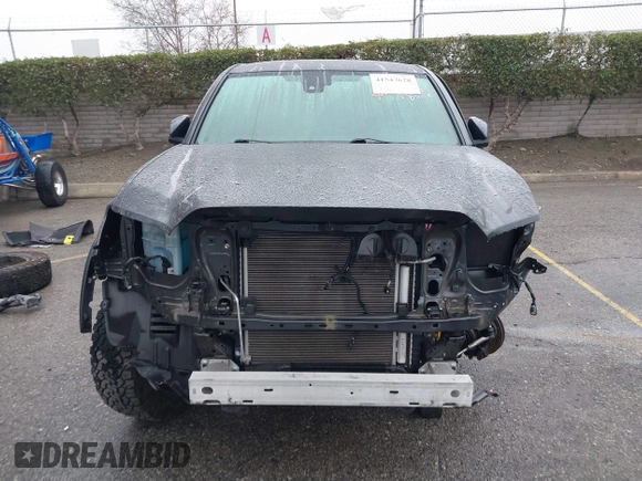 2023 Toyota Tacoma SR5 z VIN 3TMDZ5BN4PM148379, wystawiony jako IAAI lot #41547628 z przebiegiem 30 001 mil mil oraz . Historia ofert i sprzedaży dostępna na DreamBid. Obrazek 13.